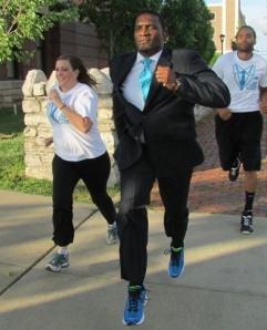 What's this? Running in a suit?